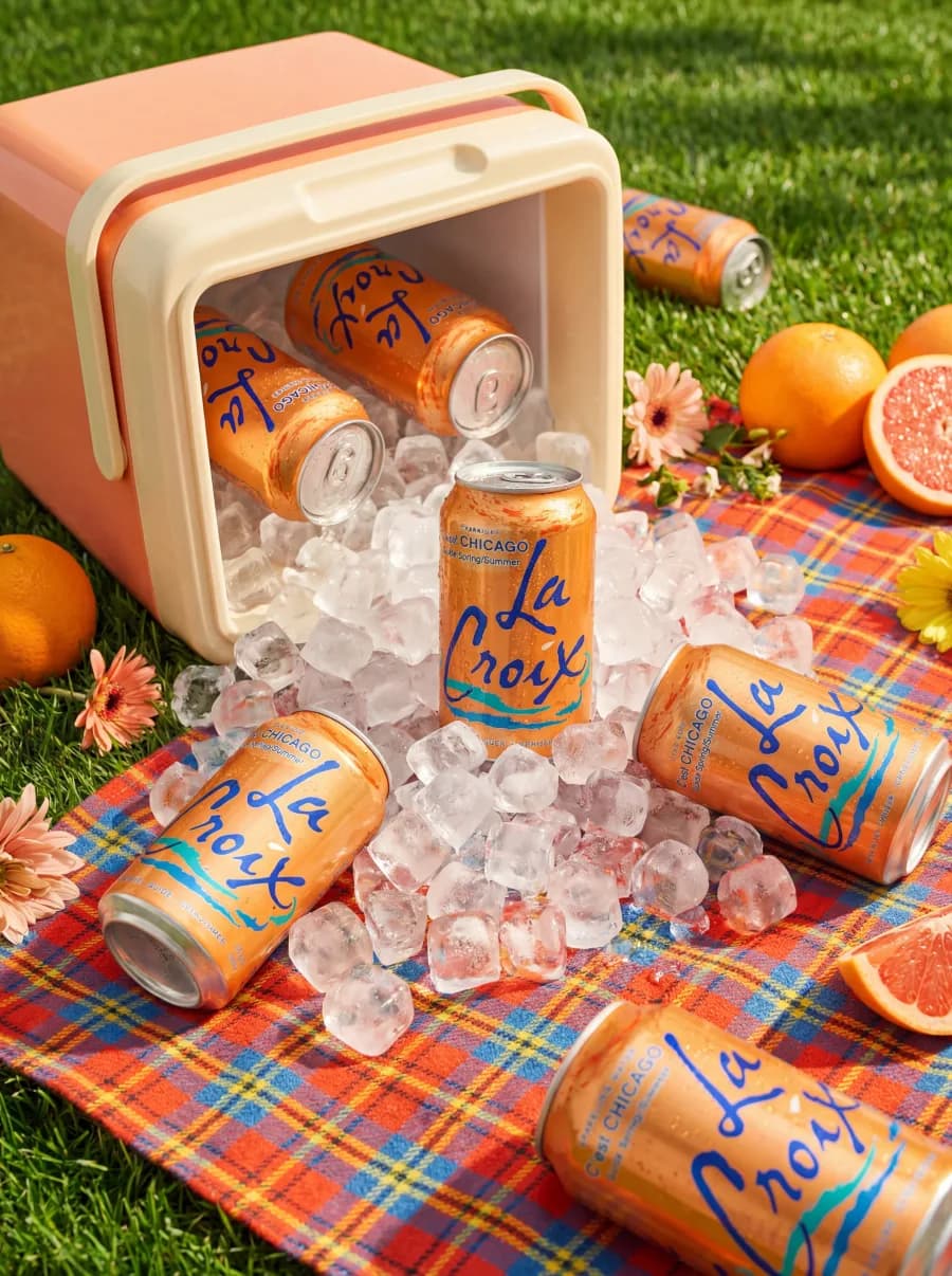 Product cans displayed in a styled outdoor product shot
