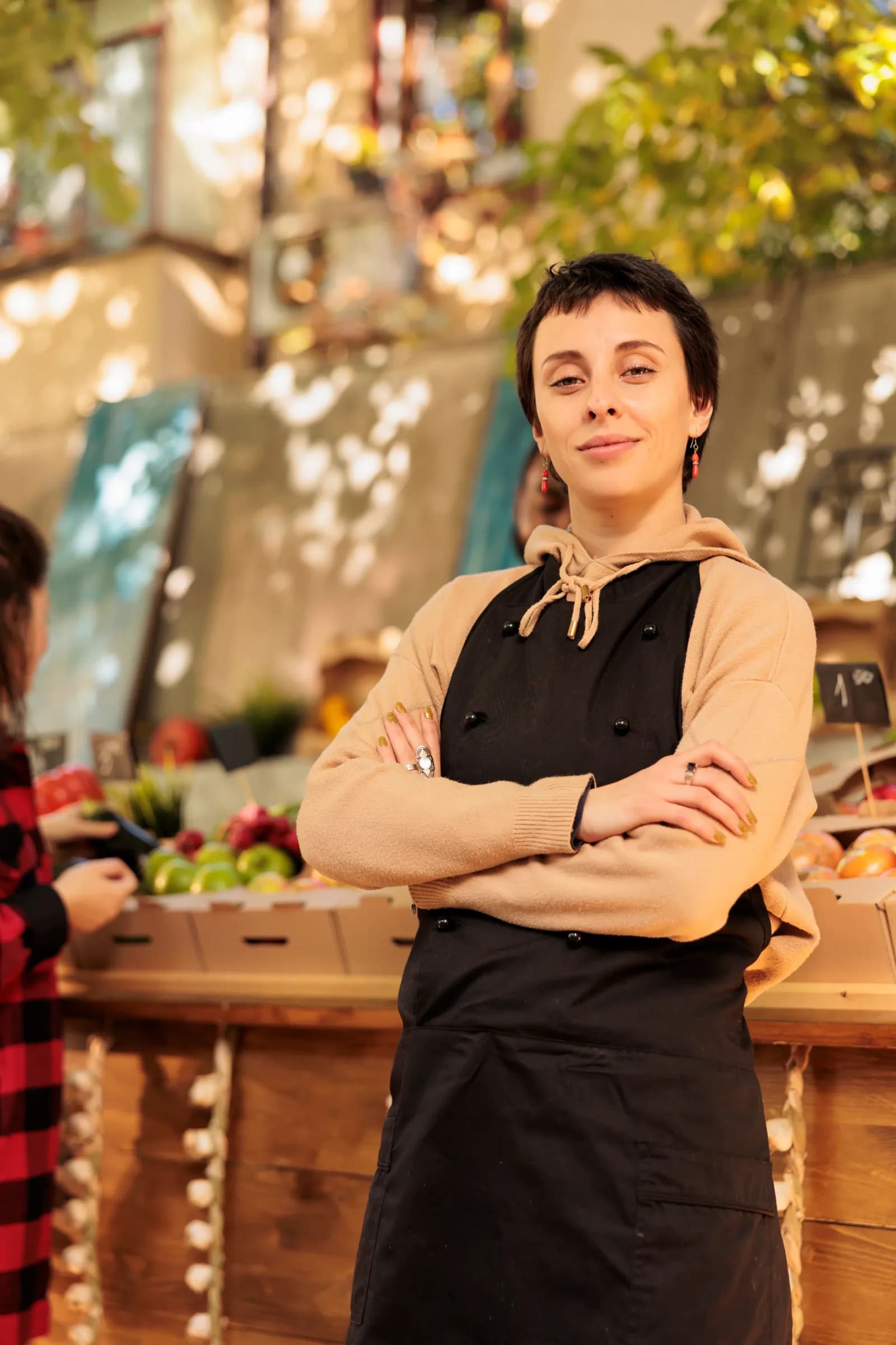 Market vendor standing at a fresh produce stall