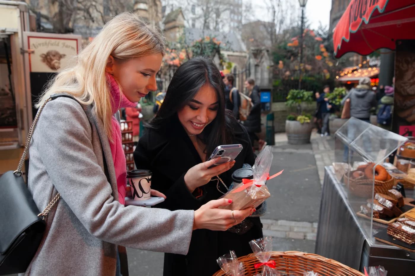 Store owners planning paid social video campaigns on mobile