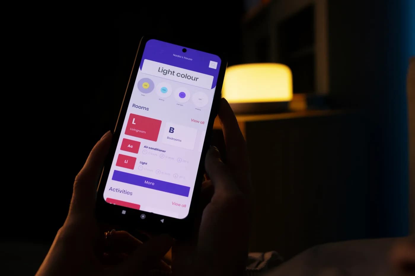 Person holding a smartphone showing a mobile app launch ad