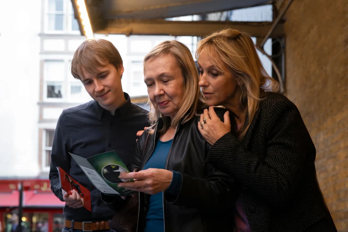 Family reviewing finances together for a fintech app ad