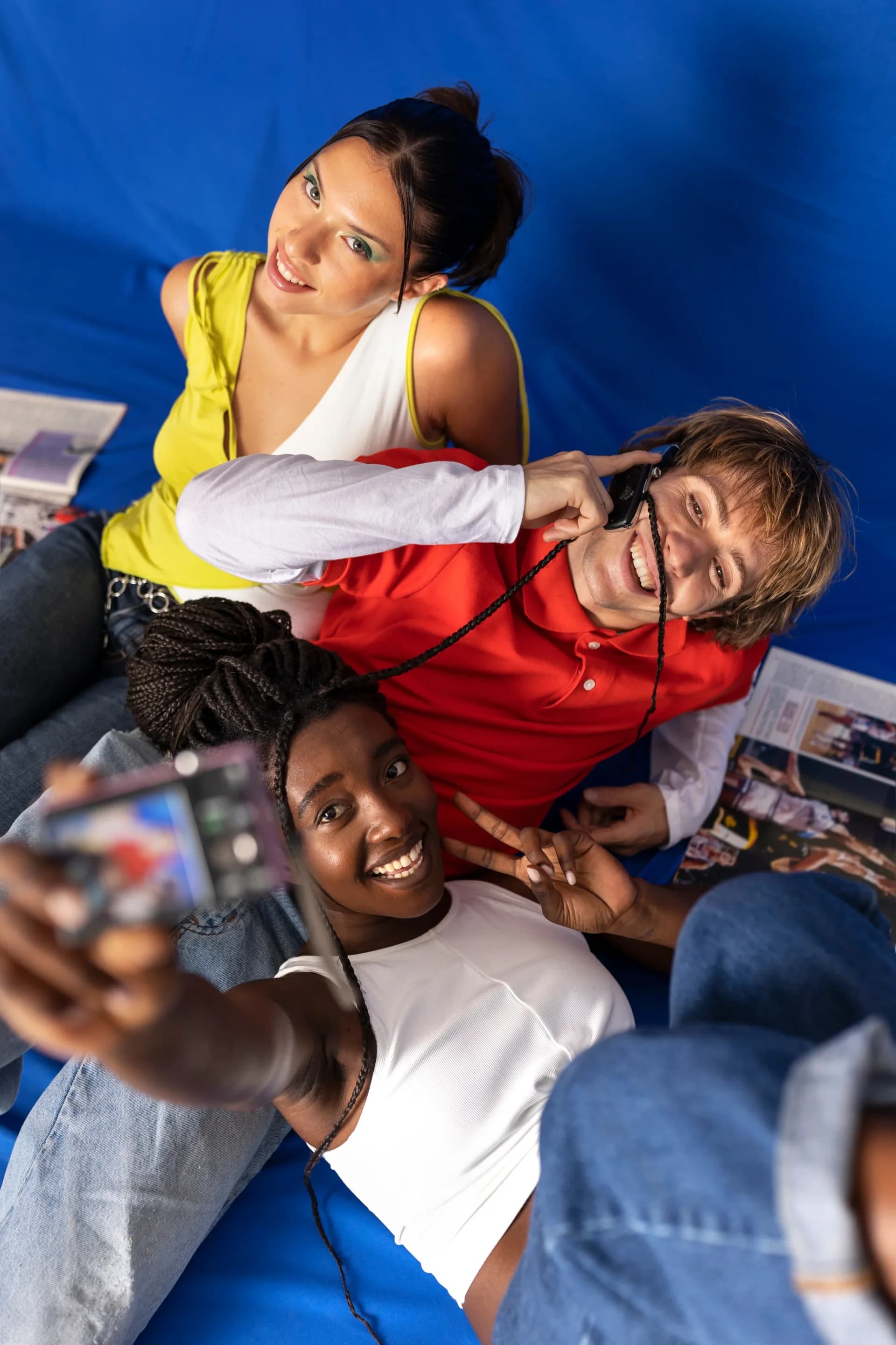 Two creators relaxing with headphones, smiling