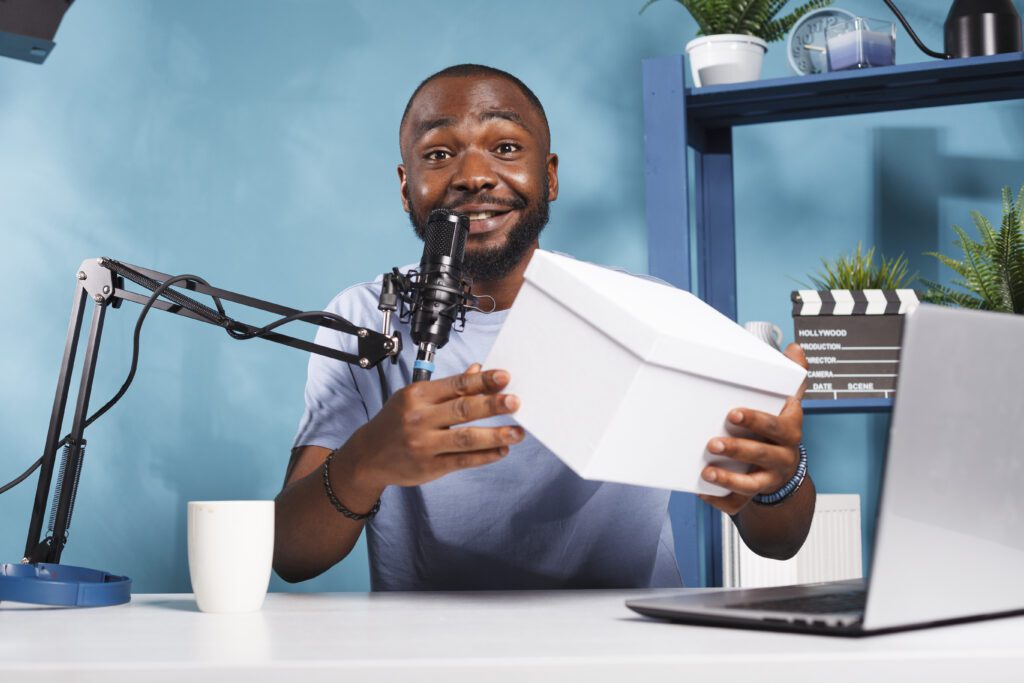Influencer recording giveaway contest – VidAU.ai A man creating video ads for a product