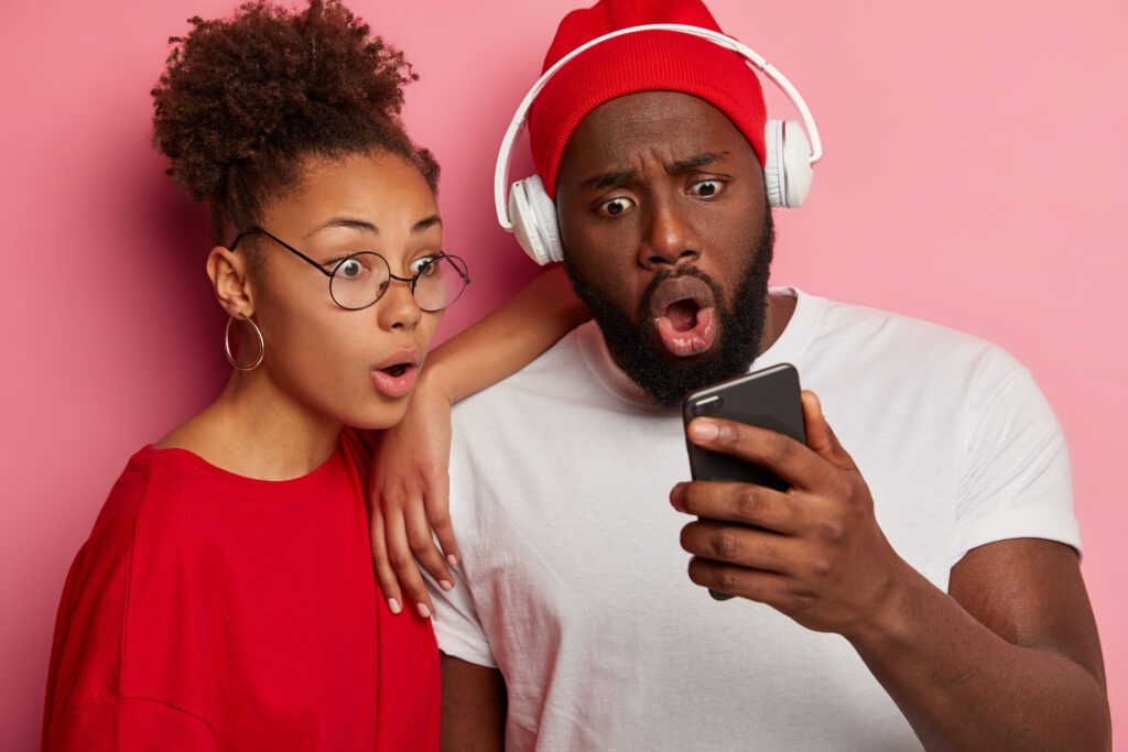 A man and woman surprised to know how youtube to mp3 converter yt1 works