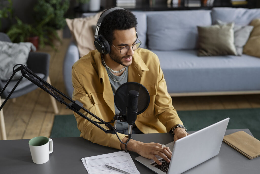 high-angle-young-man-recording-podcast how to download youtube videos