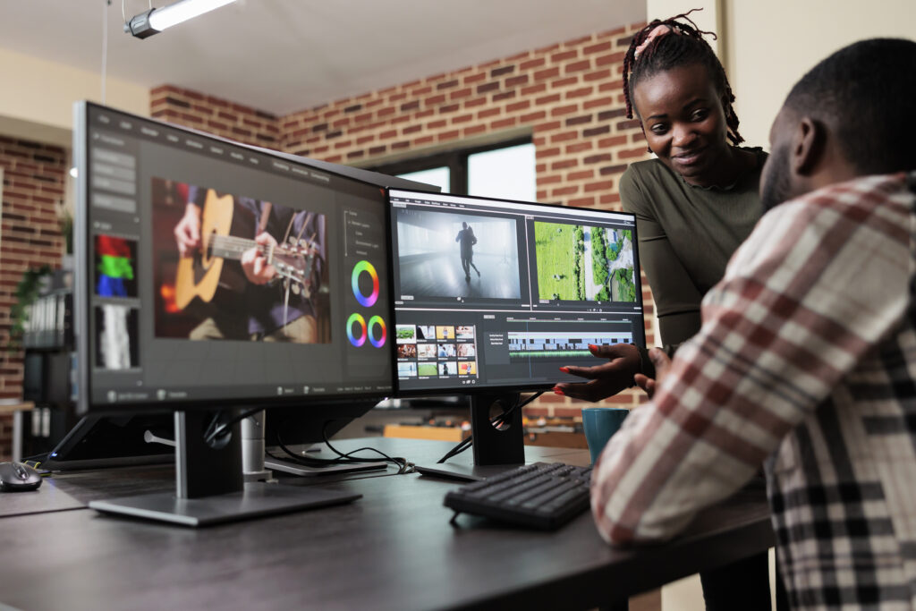 Post production department leader advising colleague to improve colors how to merge two videos
