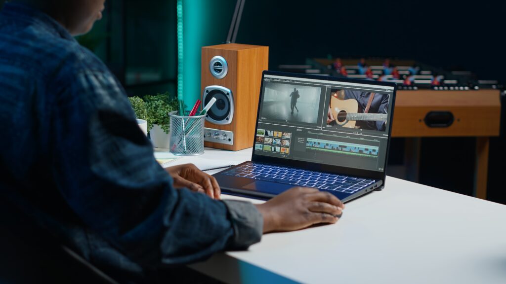 Video editor analyzing film montage on laptop combine mp4 files