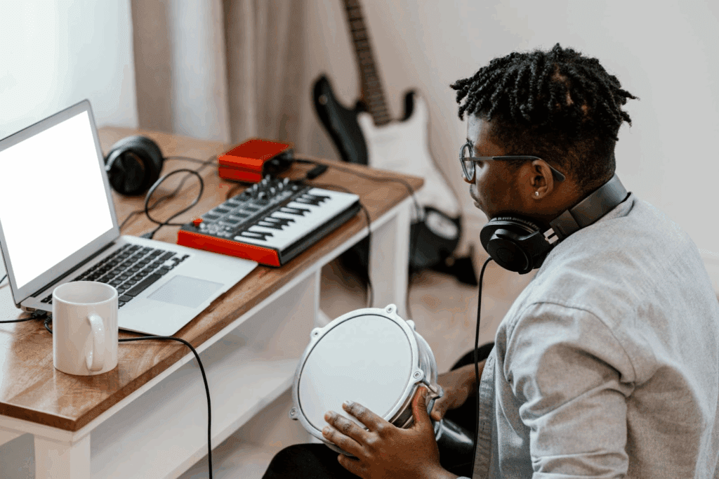 A man playing the instrument and trying an online sound test