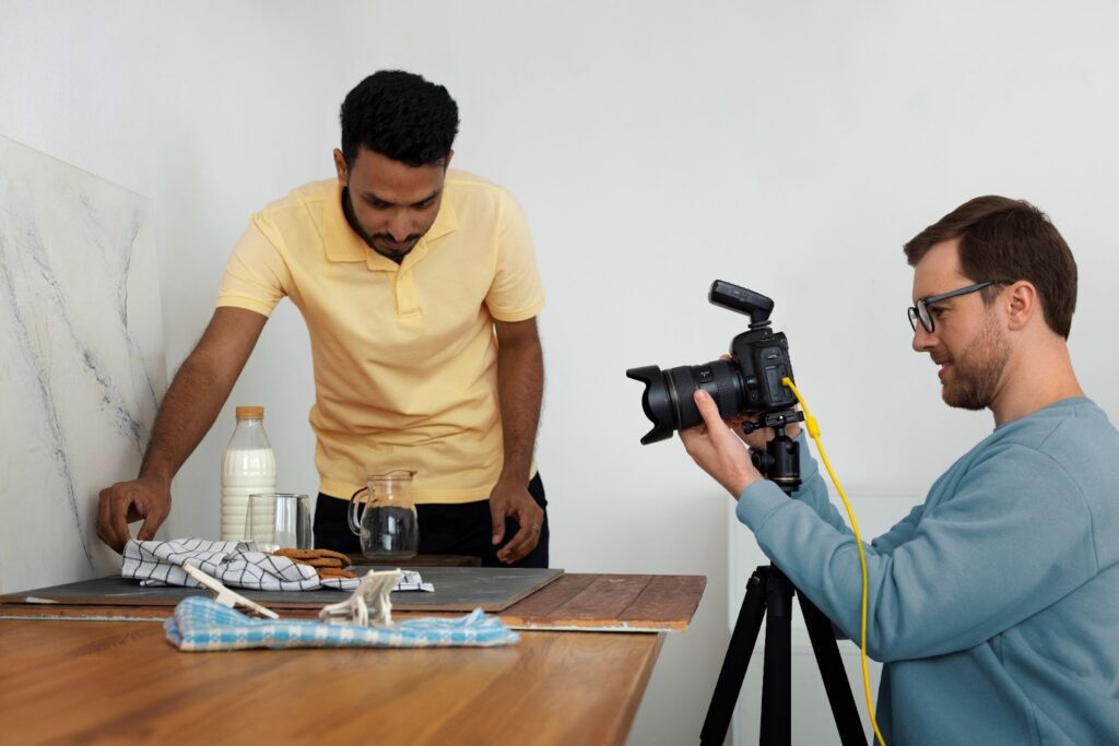 Two men working the video production services for their company