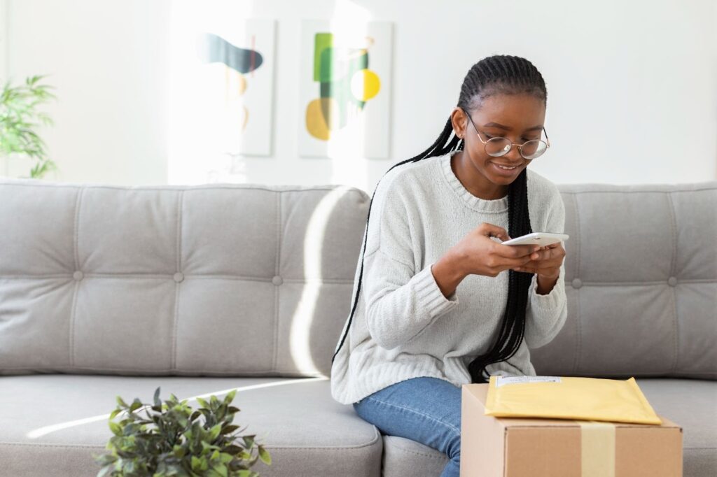 image – VidAU.ai A lady sending her received package to her supplier dropshipping on shopify