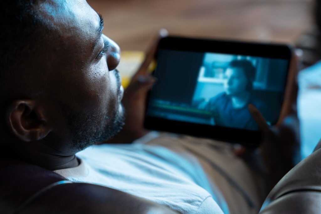 image – VidAU.ai A man watching a video he converted from mkv to mp4