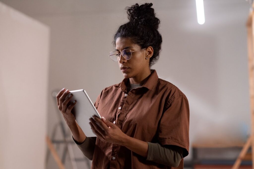 image – VidAU.ai A lady using an ai story writer for her new book