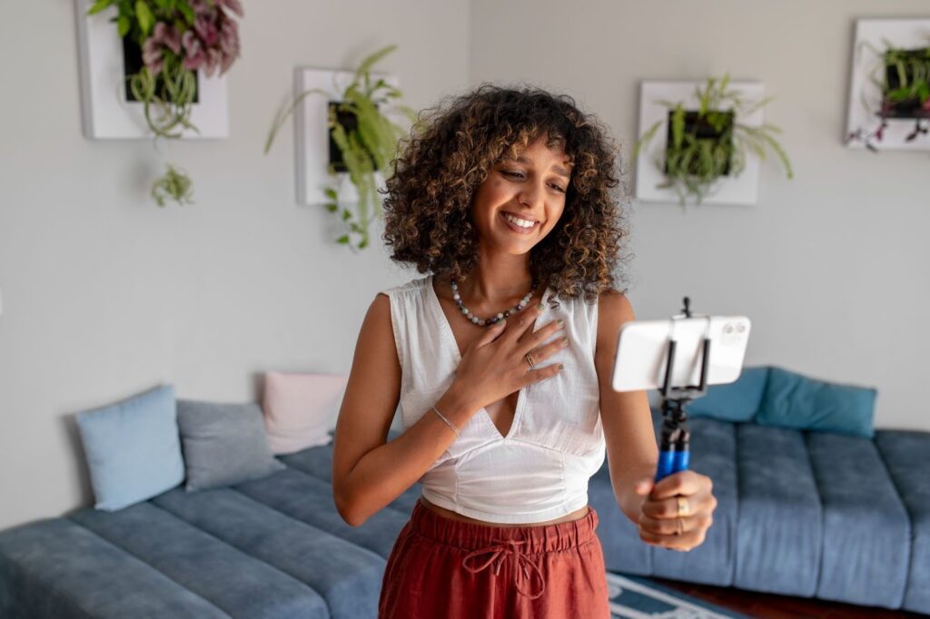 A lady recording videos for TikTok Creator rewards after researching “How much does tiktok pay