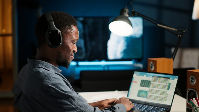 African american analyst works on accounting analysis while he is dancing
