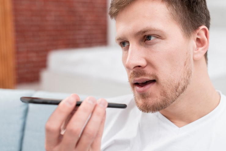 image – VidAU.ai A man enabling text to speech on his phone